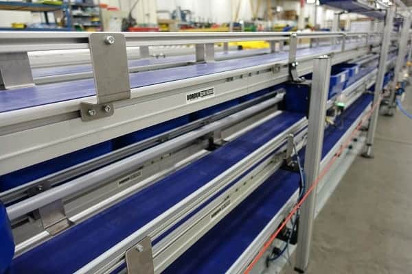 The side of a Dorner conveyor for material handling.